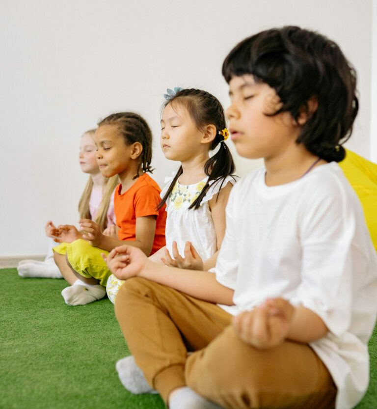 Children meditating in a Kusala mindfulness session
